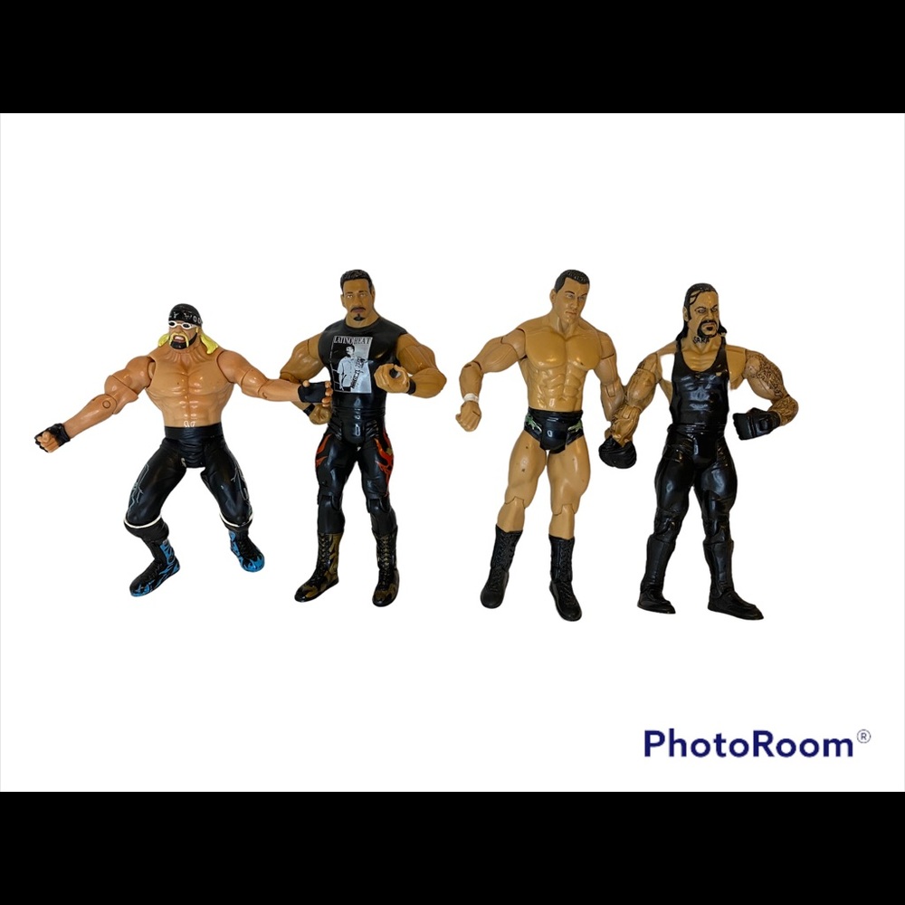 lot of 4  vintage WWE action figures.